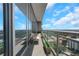 Balcony with glass railing and potted plants overlooking beautiful city views at 1065 Peachtree Ne St # 3003, Atlanta, GA 30309