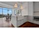 Modern kitchen with stainless steel appliances, farmhouse sink, and hardwood floors at 1065 Peachtree Ne St # 3003, Atlanta, GA 30309
