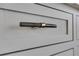 Close up of kitchen drawers with stainless steel pull hardware at 1065 Peachtree Ne St # 3003, Atlanta, GA 30309