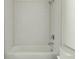 Clean white bathroom with a tiled shower and a bathtub and toilet at 2029 Memorial Dr # 34, Atlanta, GA 30317