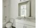 Bright bathroom with a toilet, shower, and vanity with a white countertop at 2029 Memorial Dr # 34, Atlanta, GA 30317
