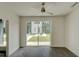 Bright bedroom with ceiling fan and sliding glass door overlooking backyard lawn at 2029 Memorial Dr # 34, Atlanta, GA 30317