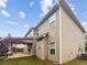 View of home's exterior with siding, covered patio, and well-maintained lawn at 3650 Lindsy Brooke Ct, Douglasville, GA 30135