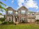 Charming two-story home featuring a mix of stone and brick, an attached two-car garage, and a manicured lawn at 3650 Lindsy Brooke Ct, Douglasville, GA 30135