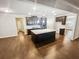 Gourmet kitchen featuring stainless steel appliances, a granite island with seating, and custom cabinetry at 3650 Lindsy Brooke Ct, Douglasville, GA 30135