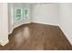 Bright living room with hardwood floors and multiple windows offering natural light at 3650 Lindsy Brooke Ct, Douglasville, GA 30135