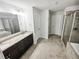 This is a large main bathroom with double sinks, a vanity with lots of storage, and separate tub and shower at 3650 Lindsy Brooke Ct, Douglasville, GA 30135