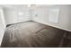 Large main bedroom with tray ceiling, ceiling fan, and multiple windows at 3650 Lindsy Brooke Ct, Douglasville, GA 30135