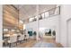 Bright and airy dining area with high ceilings, modern lighting, and an open floor plan at 2013 Old Atlanta Rd, Cumming, GA 30041