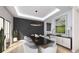 Contemporary dining room featuring sleek decor, ample natural light, and stylish light fixture at 2013 Old Atlanta Rd, Cumming, GA 30041