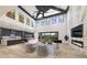 Open concept living room featuring a fireplace, high ceilings, and modern design at 2013 Old Atlanta Rd, Cumming, GA 30041
