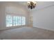 Spacious bedroom with large windows and a neutral color palette at 858 Middle Fork Trl, Suwanee, GA 30024