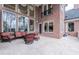 Large brick patio with multiple seating areas and access to backyard at 3133 Saint Ives Country Club Pkwy, Johns Creek, GA 30097
