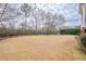 Large grassy backyard, mature trees, and privacy at 3133 Saint Ives Country Club Pkwy, Johns Creek, GA 30097