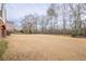 Large backyard with mature trees and grass at 3133 Saint Ives Country Club Pkwy, Johns Creek, GA 30097
