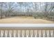 Open backyard view with large grassy area and mature trees at 3133 Saint Ives Country Club Pkwy, Johns Creek, GA 30097