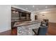 Curved bar with stone backsplash and glass shelving at 3133 Saint Ives Country Club Pkwy, Johns Creek, GA 30097