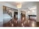 Open basement plan with hardwood floors, pool table, and wet bar at 3133 Saint Ives Country Club Pkwy, Johns Creek, GA 30097