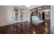 Bright basement room with hardwood floors and access to the stairs at 3133 Saint Ives Country Club Pkwy, Johns Creek, GA 30097