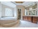 Elegant bathroom with soaking tub, shower, and vanity at 3133 Saint Ives Country Club Pkwy, Johns Creek, GA 30097