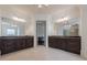 Large bathroom with double vanities and dark brown cabinets at 3133 Saint Ives Country Club Pkwy, Johns Creek, GA 30097