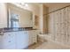 Bathroom with single vanity, granite countertop and shower/tub combo at 3133 Saint Ives Country Club Pkwy, Johns Creek, GA 30097