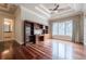 Spacious bedroom with hardwood floors and built-in shelving at 3133 Saint Ives Country Club Pkwy, Johns Creek, GA 30097