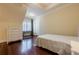 Bedroom with hardwood floors and a window seat at 3133 Saint Ives Country Club Pkwy, Johns Creek, GA 30097