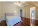 Bedroom with hardwood floors and access to a bathroom at 3133 Saint Ives Country Club Pkwy, Johns Creek, GA 30097