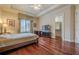 Bedroom with hardwood floors and a walk-in closet at 3133 Saint Ives Country Club Pkwy, Johns Creek, GA 30097