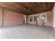 Covered patio with brick walls, wood ceiling, and large windows at 3133 Saint Ives Country Club Pkwy, Johns Creek, GA 30097