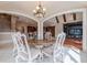 Elegant dining room with hardwood floors and a large table at 3133 Saint Ives Country Club Pkwy, Johns Creek, GA 30097