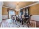 Elegant formal dining room with large table, chandelier, and built-in hutch at 3133 Saint Ives Country Club Pkwy, Johns Creek, GA 30097