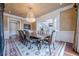 Formal dining room with a large table, chandelier, and view of a staircase at 3133 Saint Ives Country Club Pkwy, Johns Creek, GA 30097