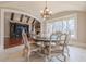 Bright dining room with hardwood floors and views to Gathering room at 3133 Saint Ives Country Club Pkwy, Johns Creek, GA 30097