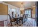 Formal dining room features a large table, chandelier, and access to other rooms at 3133 Saint Ives Country Club Pkwy, Johns Creek, GA 30097