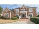 Impressive two-story home with brick exterior at 3133 Saint Ives Country Club Pkwy, Johns Creek, GA 30097