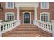 Two-story entry with double iron doors at 3133 Saint Ives Country Club Pkwy, Johns Creek, GA 30097
