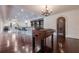 Basement game room with foosball table and hardwood floors at 3133 Saint Ives Country Club Pkwy, Johns Creek, GA 30097