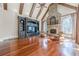Gathering room boasts hardwood floors, stone fireplace, and built-in shelving at 3133 Saint Ives Country Club Pkwy, Johns Creek, GA 30097