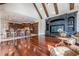 Open Gathering room with hardwood floors, kitchen views, and high ceilings at 3133 Saint Ives Country Club Pkwy, Johns Creek, GA 30097
