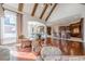 Gathering room with hardwood floors, kitchen access and vaulted ceilings at 3133 Saint Ives Country Club Pkwy, Johns Creek, GA 30097