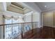 Open and bright hallway with hardwood floors and a chandelier at 3133 Saint Ives Country Club Pkwy, Johns Creek, GA 30097