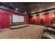 Home theater with large screen, seating, and a starlit ceiling at 3133 Saint Ives Country Club Pkwy, Johns Creek, GA 30097