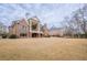 Brick house exterior, large backyard, partial view at 3133 Saint Ives Country Club Pkwy, Johns Creek, GA 30097