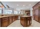 Large kitchen with island, granite countertops, and stainless steel appliances at 3133 Saint Ives Country Club Pkwy, Johns Creek, GA 30097