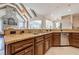 Kitchen features expansive island with sink and views into Gathering room at 3133 Saint Ives Country Club Pkwy, Johns Creek, GA 30097