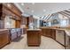Gourmet kitchen with island, stainless steel appliances, and custom cabinetry at 3133 Saint Ives Country Club Pkwy, Johns Creek, GA 30097