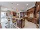 Gourmet kitchen with large island, custom cabinetry, and pendant lighting at 3133 Saint Ives Country Club Pkwy, Johns Creek, GA 30097