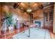 Study with wood paneled walls, fireplace, built-in shelving and hardwood floors at 3133 Saint Ives Country Club Pkwy, Johns Creek, GA 30097
